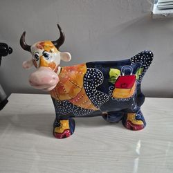 Vintage ceramic cow figurine designed and hand-painted by artist Anatoly Turov. 
Artist: Anatoly Turov (signed to base).