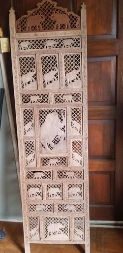 Hand carved wood elephant panel.