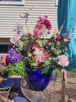 2 Large Ceramic Vases with large beautiful artificial flowers that were custom made.