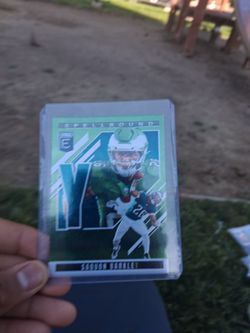 2025 Panini Donruss Elite Spellbound Saquon Barkley football trading card in protective case. Card shows minor handling wear, great for collectors and