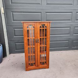 Wood and Glass Media cabinet with 6 shelves 
48"T X 26"W X 9"Deep read description for details 