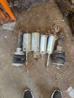 Air bags and cylinders for air ride suspension.