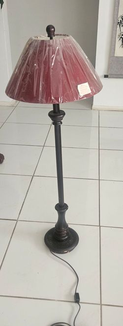 Like new standing floor lamp, original protective film on shade, works perfectly. Retro style matches most home interiors. 30"H