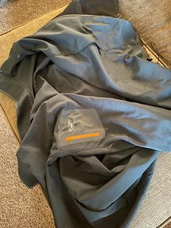 Large authentic Arc’teryx windbreaker (used/little ripped)