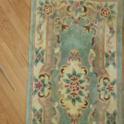 Teal/ Reddish Rug With Flowers