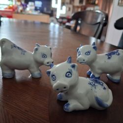 vintage blue and white ceramic cow collectible figurines