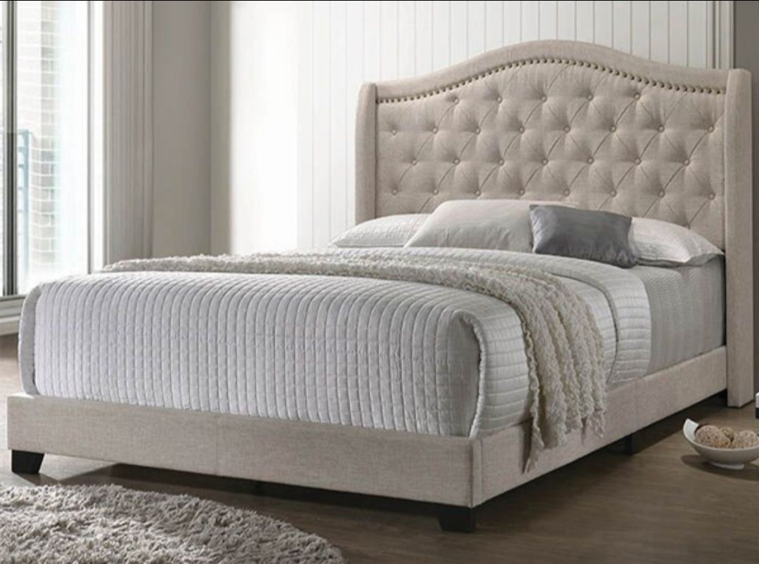 Beige arched queen bed
