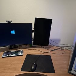 Windows 10 PC with monitors and accessories.
