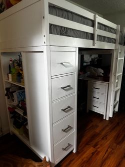 Twin bunk bed with desk
