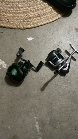 2 fishing reels both used maybe three times bait-casting and regular reel