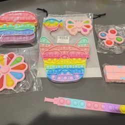 Brand new 8 PCS unique mini fidget toys including Cat with Glasses, Sandwich Toy, Finger Spinner, Wristband, and 4 additional sensory toys