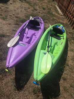 Two Pelican Sit-In Kayaks with Paddles