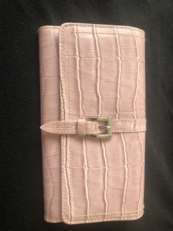 Pink wallet with snap closure