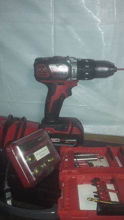 Milwaukee fast charger 3.0 battery and hammer drill some bits oil scrwe shaser set