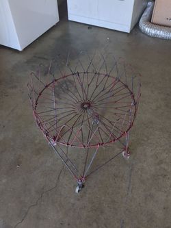 This is a vintage collapsible wire laundry basket,  from the 1960s or 1970s.