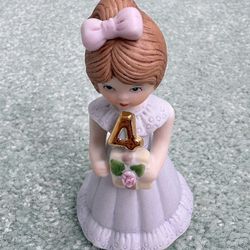 Vintage 1982 Enesco age 4 Pune porcelain figurine from the growing up girls collection