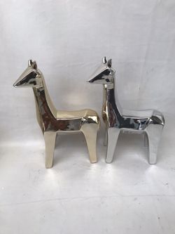 Resin. Silver and gold set of giraffes $20 for both