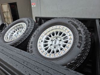 17" KMC BRAND NEW w- 33" Falken AT tires. $1350 !!!