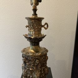 Vintage floral brass lamp 16.5" tall to top of socket. Brass is black in places at base. Some imperfections. See photos. Cord should be rewired.