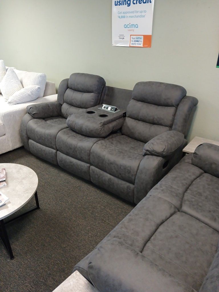 New Gray Two-piece Reclining Sofa And Loveseat Including Free Delivery