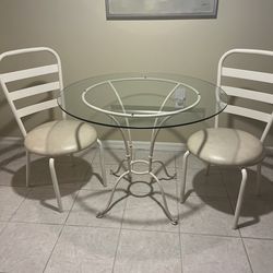 36” Glass top metal table with 2 padded chairs