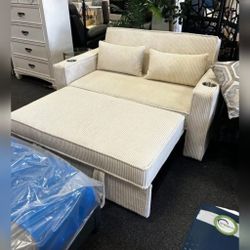 Beige corduroy convertible sofa with sleeper bed with cup holders