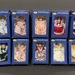 Special Times porcelain doll ornament collection.  Includes  10 dolls new in box. 