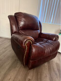 Individual brown leather armchair