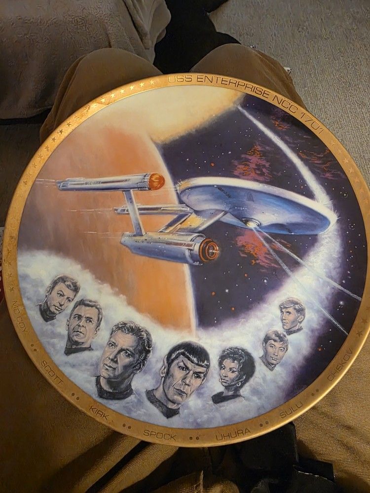 Star Trek collector's plate, specifically featuring the USS Enterprise and the original crew from Star Trek: The Original Series.