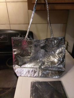 Beautiful silver brand new bag and