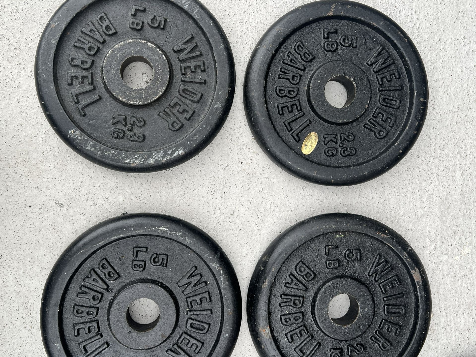  Lot of 4 WEIDER 5 lb Barbell Weights Plates Standard 1" Hole 20 lbs Total . Used in good condition with some cosmetic blemishes such as scratches and