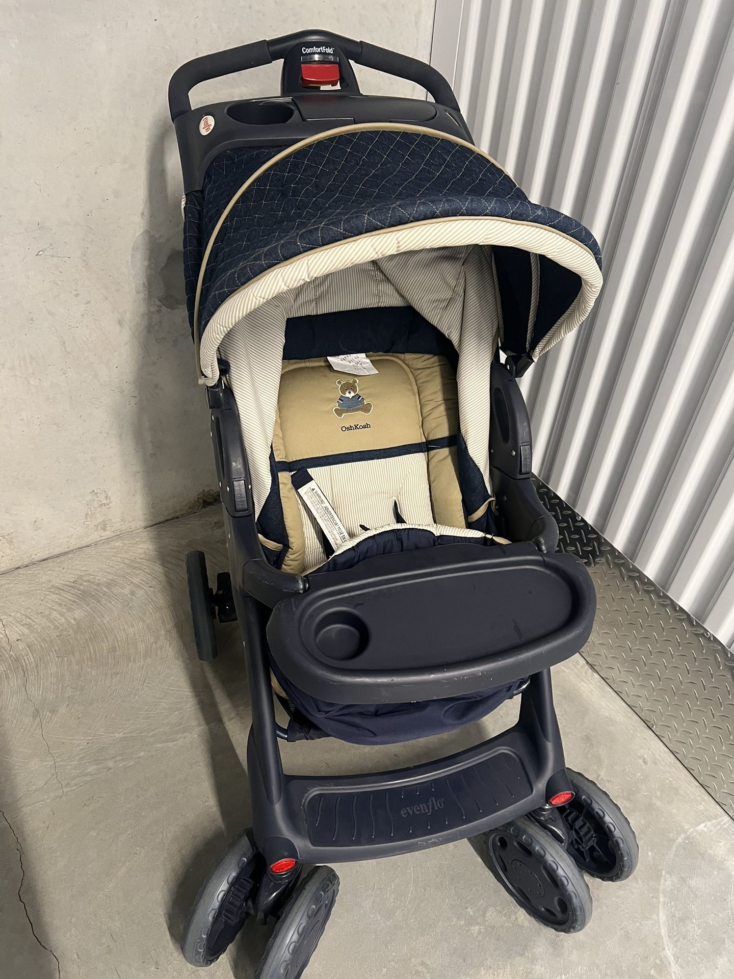 Evenflo Fold Stroller - Blue used in good condition with some minor cosmetic blemishes. These blemishes are in the form of some scratches and scuff ma