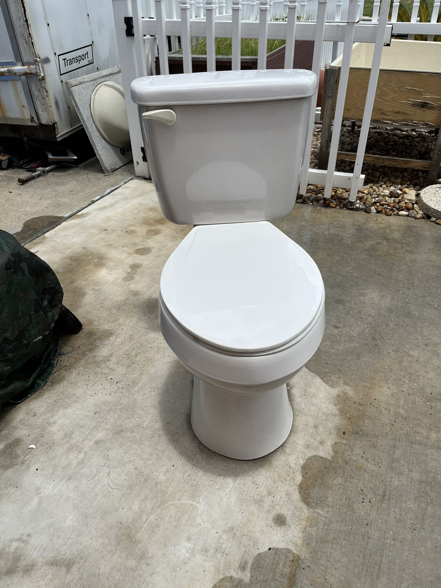 Toilet in good condition and clean, measures 18 inches high and the tank is 18 inches wide.
