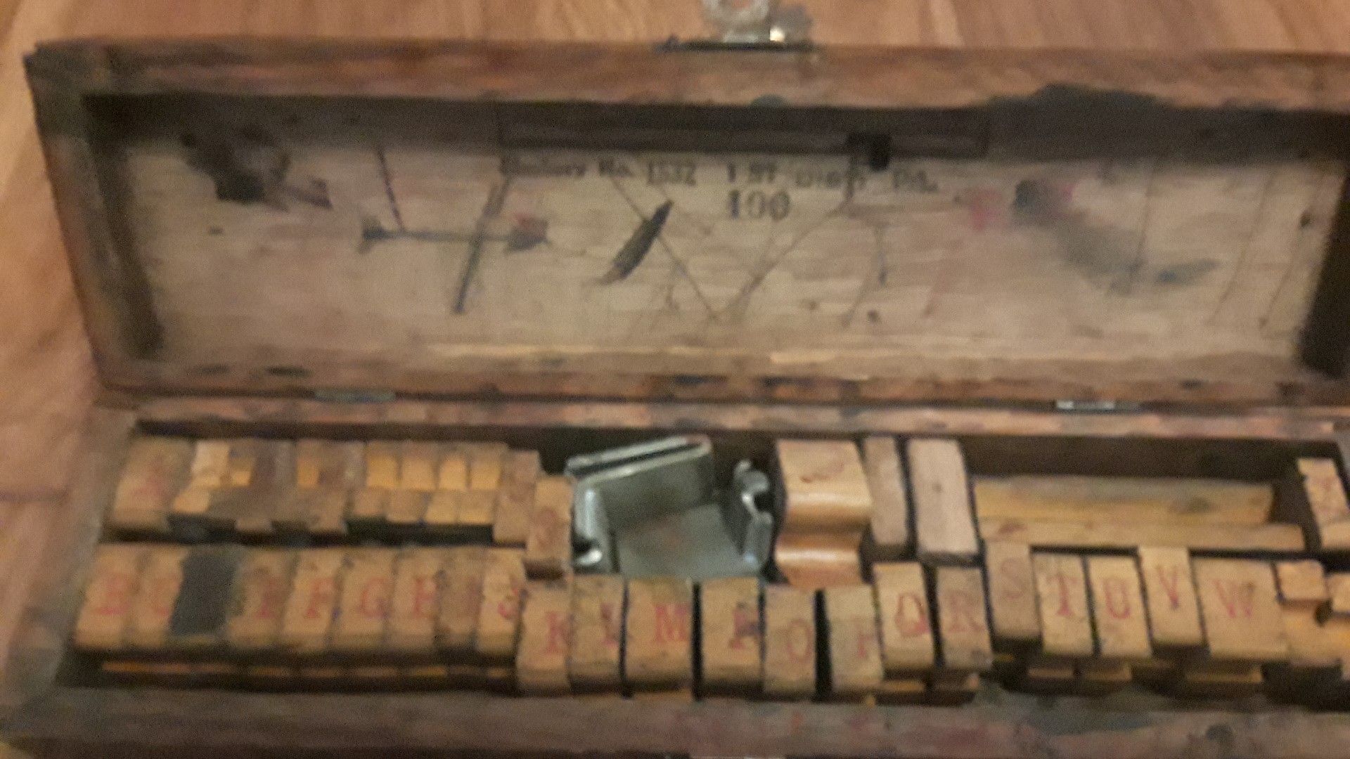 Old stamper letters and numbers in old wooden box