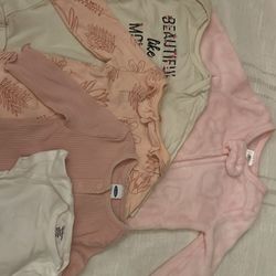 5 Newborn long sleeve onesie.
