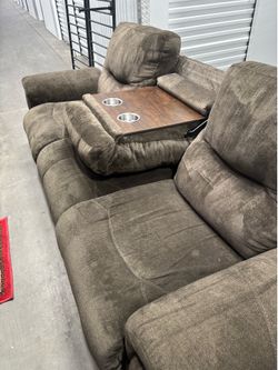 Sofa with entertainment table in the middle
