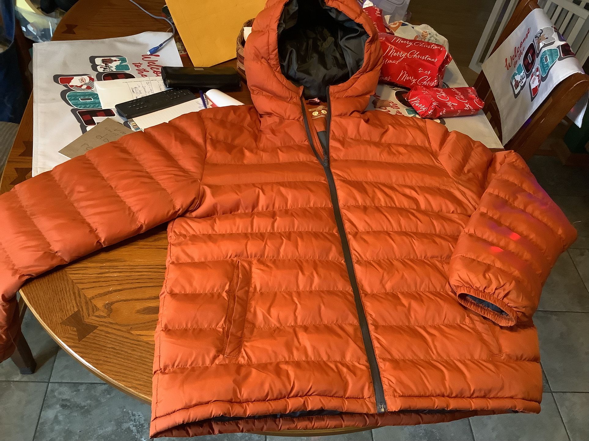 Mountain Hardwear Men’s XL Deloro Down Jacket, standard fit, no restrictions in movement, large hood, zipper front, no rips or issues. Just had dry c