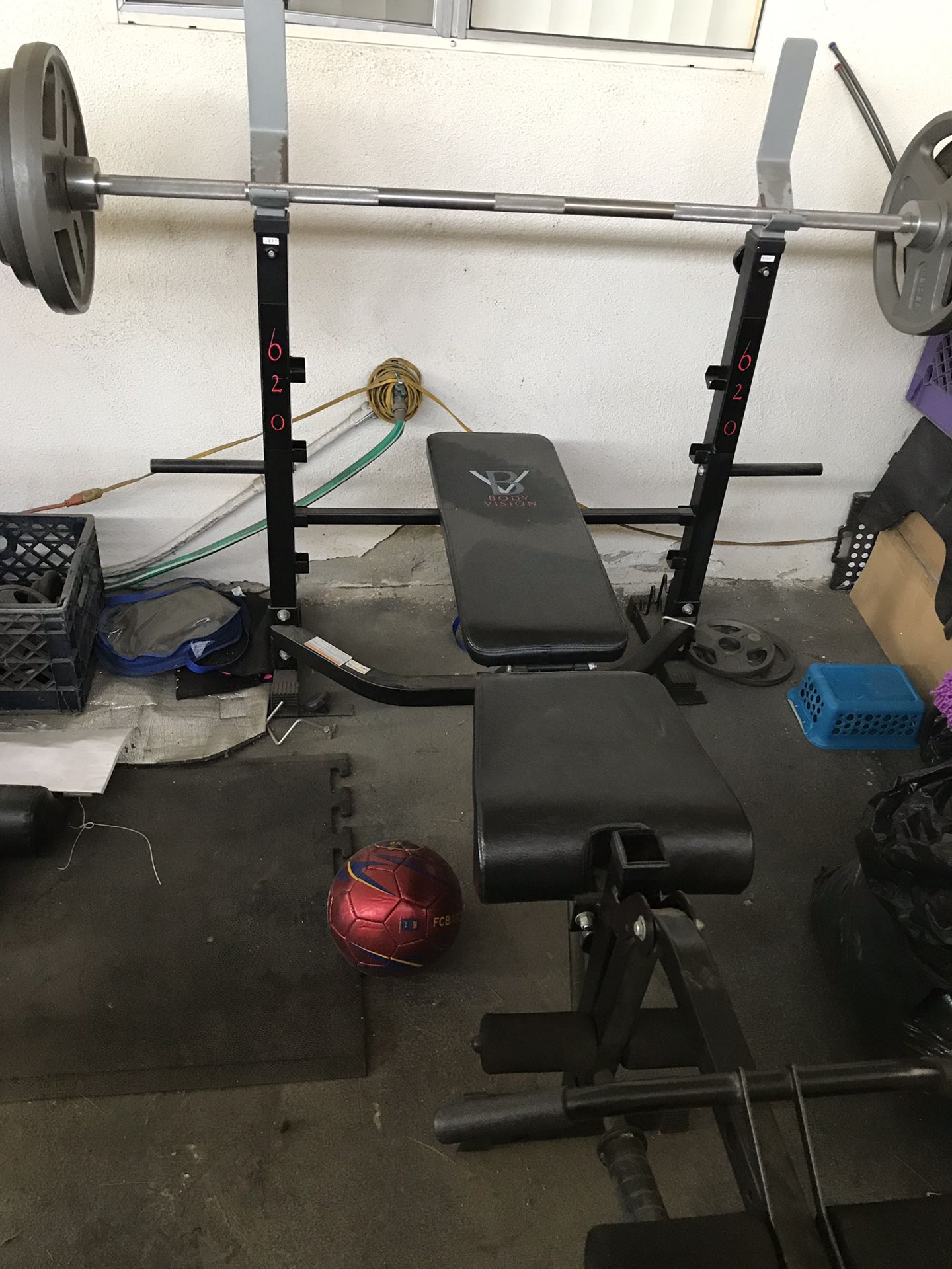 Weight bench and Olympic bar with weight plates