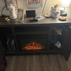Great Entertainment Center Needs A Little Work But Fireplace Works Good. One Side Needs To Be Screwed In.