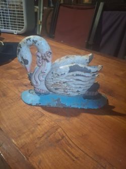 Vintage cast iron swan swimming door stop