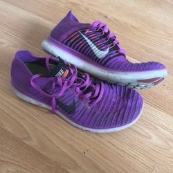 Woman’s Purple Nike shoes 