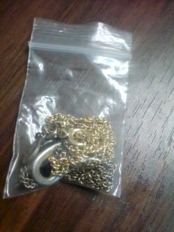 One gold necklace and one silver necklace both sold together