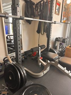 Rolling squat rack with barbell and bumper plates