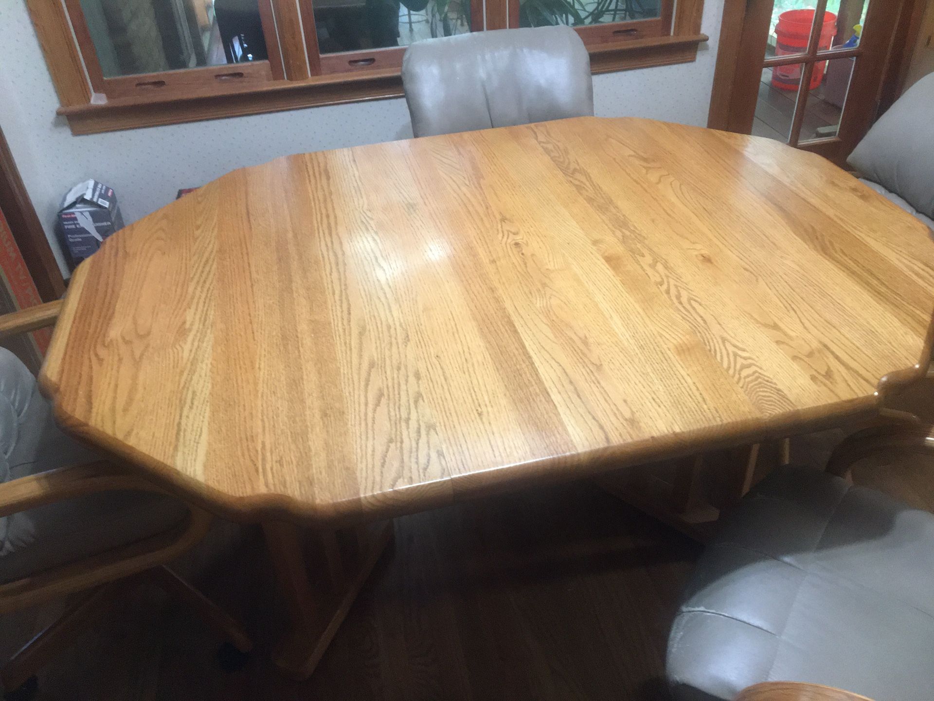 Kitchen dining table with 4 four rolling chairs 64”x47”