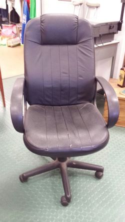 Black vinyl executive office chair on wheels