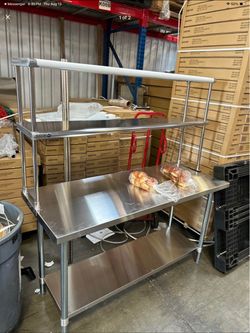Brand new restaurant equipment warehouse work tables shelves metal racks and more