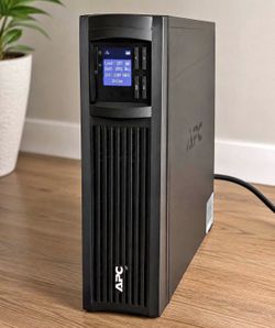 APC Smart-UPS battery backup and surge protector by Schneider Electric.