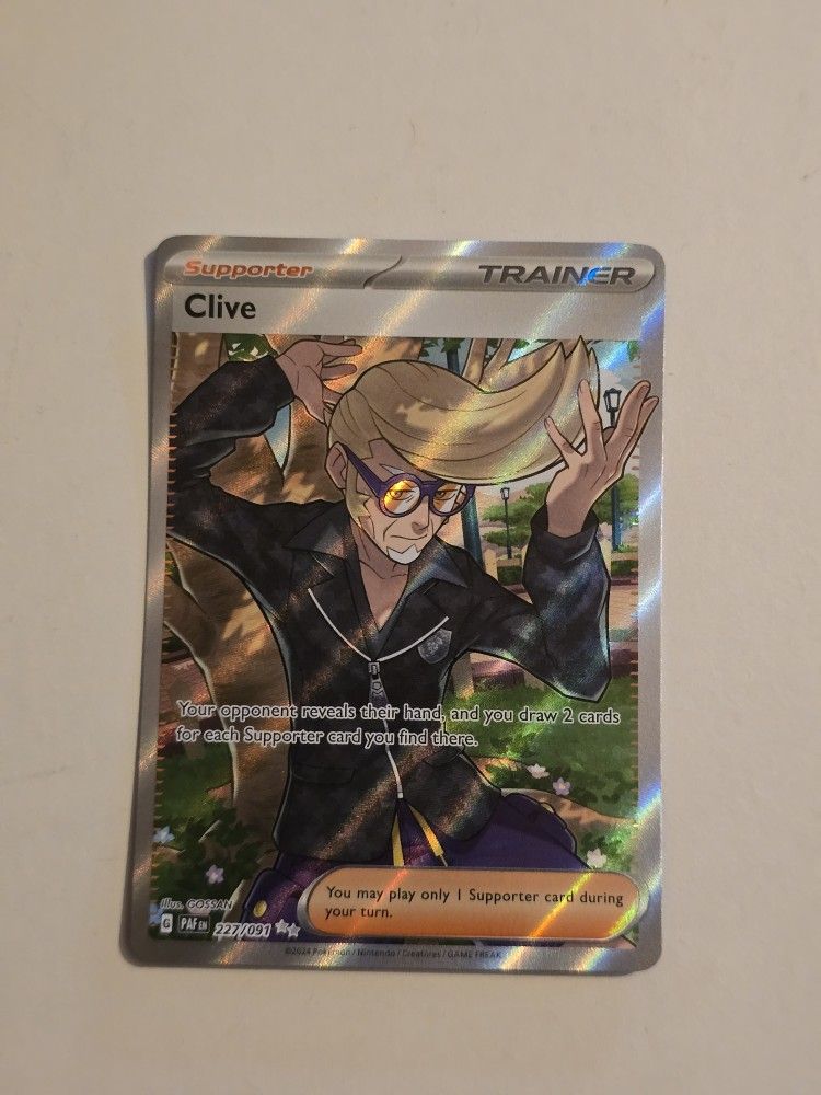 Clive 227/091 Pokemon Paldean Fates - NM