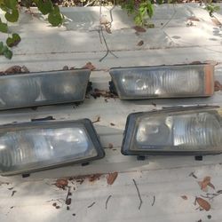 Pair of OEM "Cat Eye" Headlights for 2003-2007 Chevy Silverado / 2003-2006 Avalanche