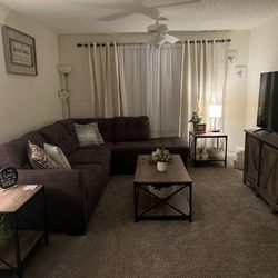 Living room sofa with two small tables plus the coffee table